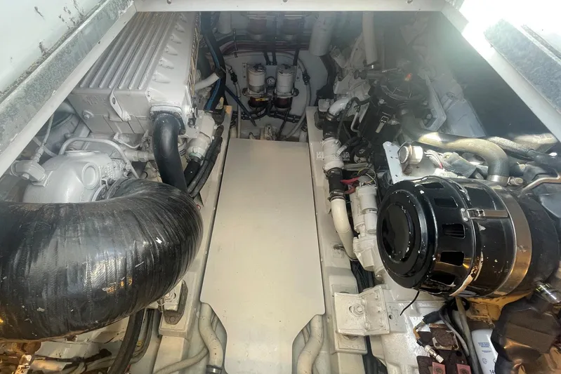 M.a.c. Daddy Yacht Photos Pics Engine compartment of 2005 Custom DeSanti Carolina Express boat, showcasing mechanical components.