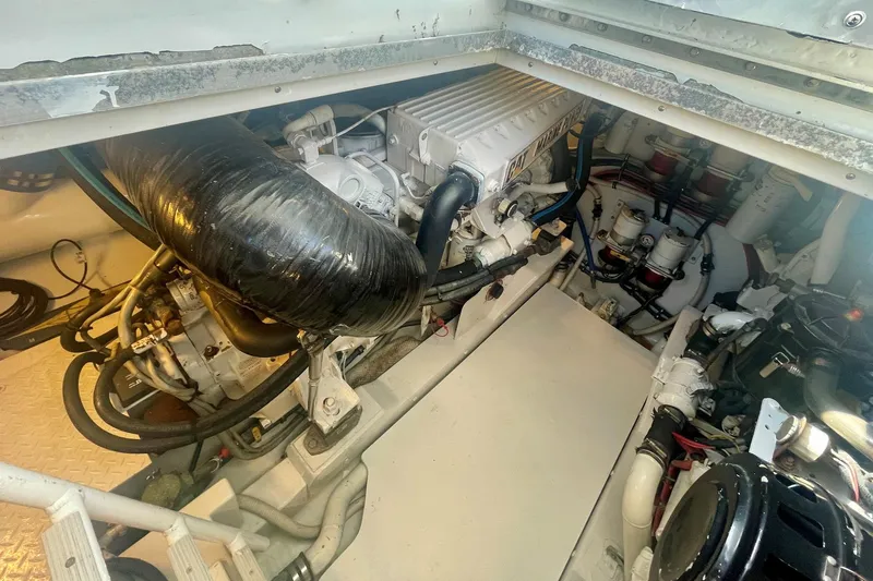 M.a.c. Daddy Yacht Photos Pics Engine compartment of 2005 Custom DeSanti Carolina Express boat, showcasing mechanical components.