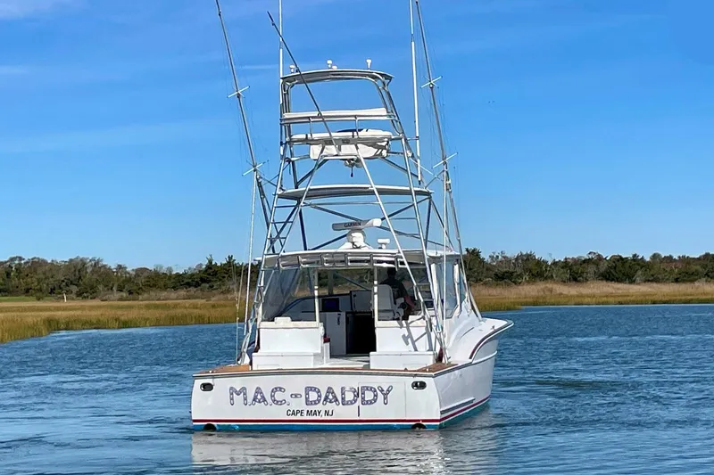 M.a.c. Daddy Yacht Photos Pics Custom 2005 DeSanti Carolina Express boat on water, labeled "MAC-DADDY," Cape May, NJ.