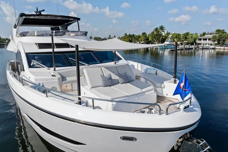 Don Tortuga Yacht Photos Pics 2024 Sunseeker Ocean 90 yacht with luxurious deck, docked by palm-lined waterfront.