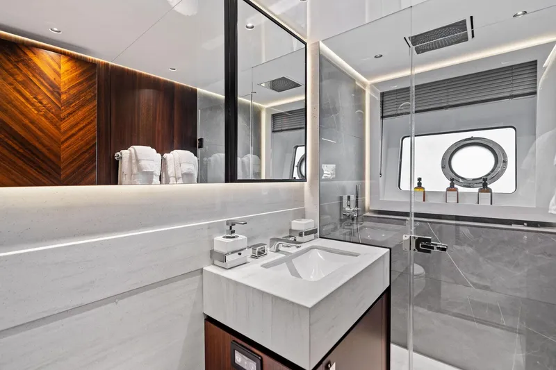 Don Tortuga Yacht Photos Pics Luxurious bathroom in 2024 Sunseeker Ocean 90 yacht, featuring modern design and elegant fixtures.