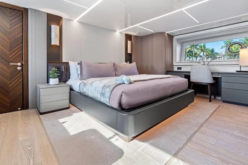 Don Tortuga Yacht Photos Pics Luxurious bedroom interior of 2024 Sunseeker Ocean 90 yacht with modern decor and ocean view.