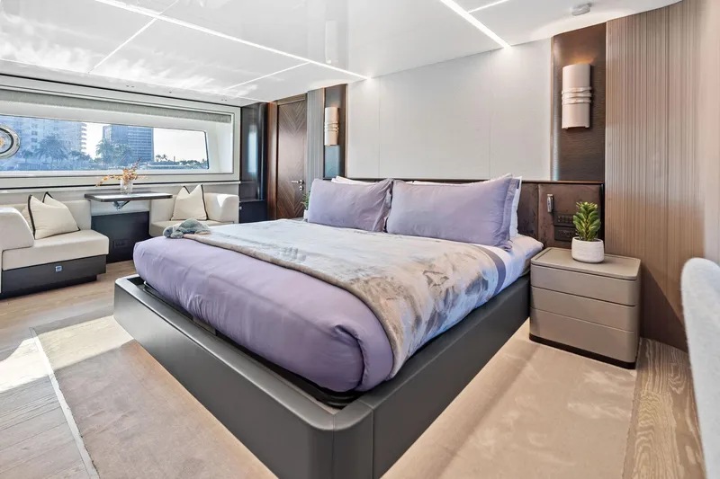 Don Tortuga Yacht Photos Pics Luxurious bedroom interior of 2024 Sunseeker Ocean 90 yacht with modern design and large window.
