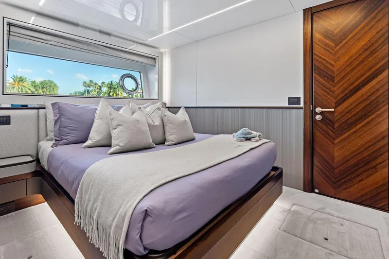 Don Tortuga Yacht Photos Pics Luxurious bedroom interior of 2024 Sunseeker Ocean 90 yacht with elegant decor.