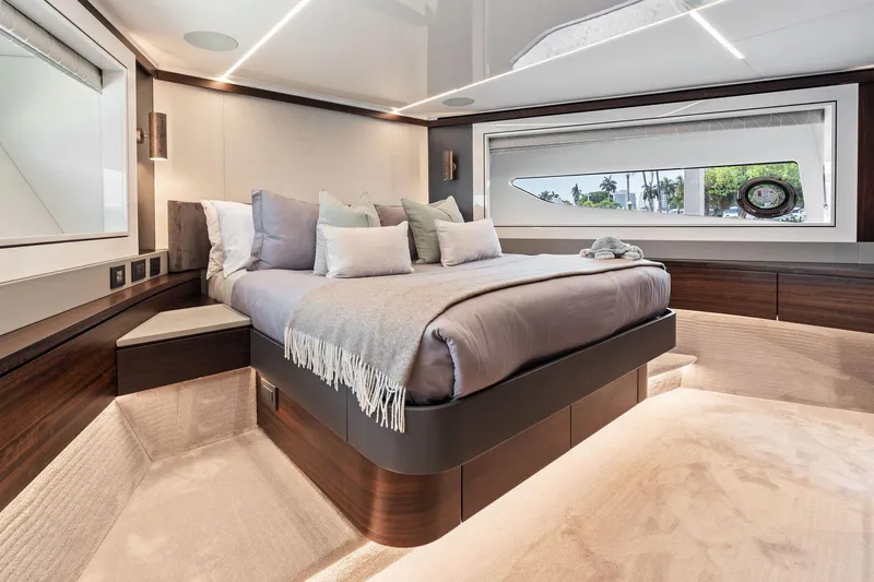 Don Tortuga Yacht Photos Pics Luxurious bedroom interior of 2024 Sunseeker Ocean 90 yacht with modern design and large window.