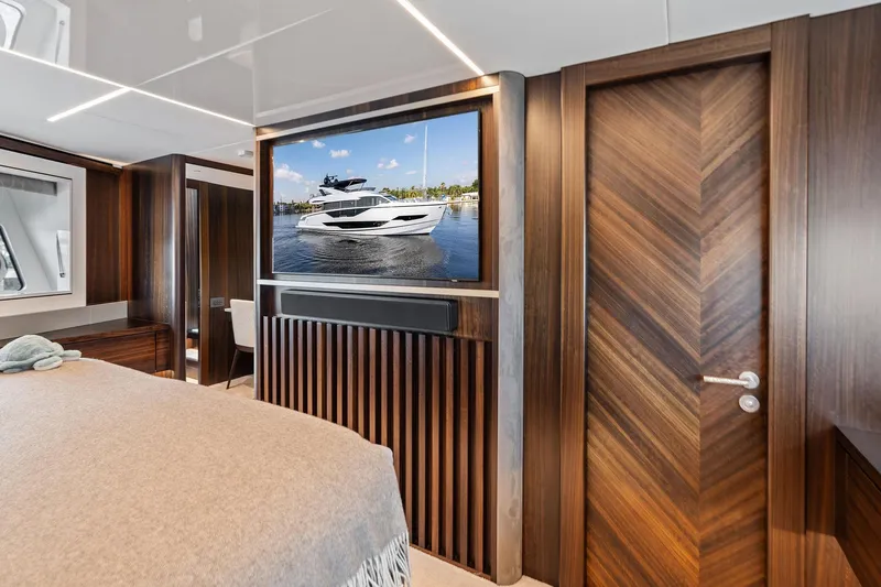 Don Tortuga Yacht Photos Pics Luxurious interior of 2024 Sunseeker Ocean 90 yacht with wood accents and modern amenities.
