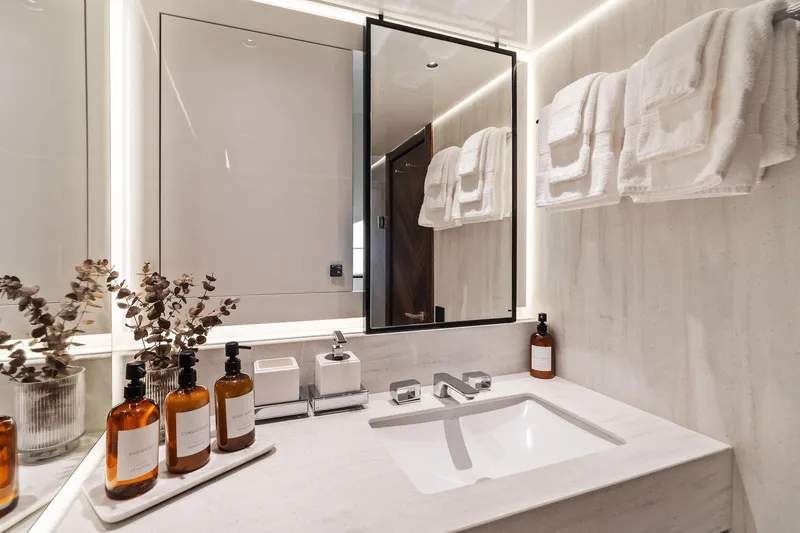 Don Tortuga Yacht Photos Pics Luxurious bathroom in 2024 Sunseeker Ocean 90 yacht with modern fixtures and elegant decor.