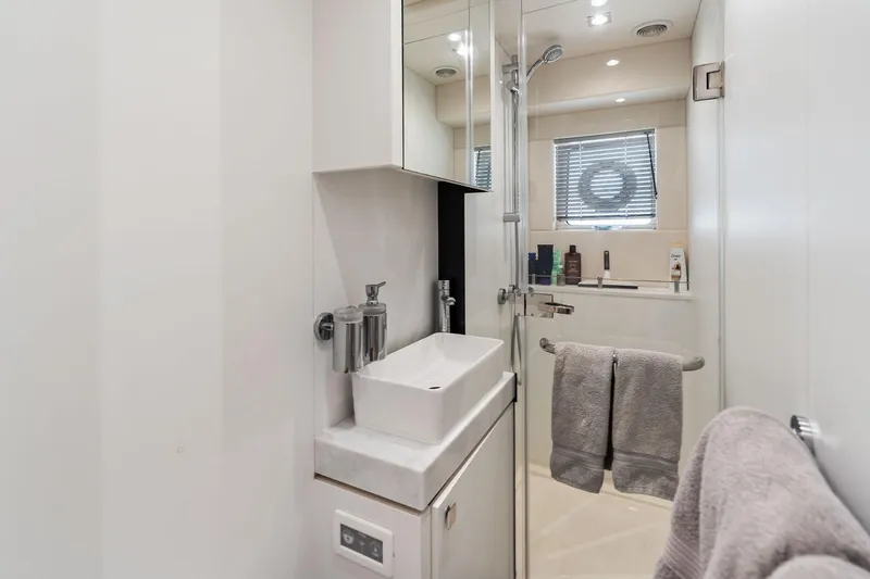 Don Tortuga Yacht Photos Pics Luxurious bathroom in 2024 Sunseeker Ocean 90 yacht, featuring modern fixtures and elegant design.