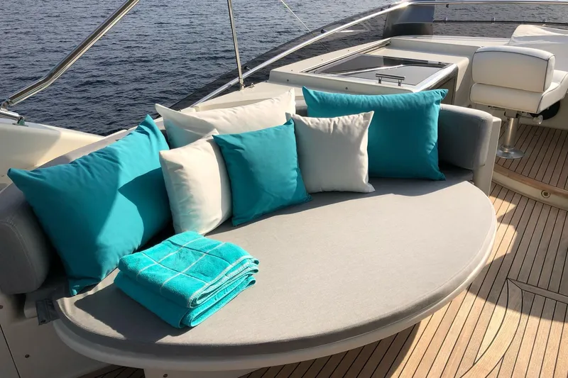  Yacht Photos Pics Luxurious Mochi 2250 yacht deck with turquoise cushions and towels, 2003 model.