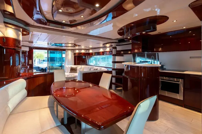  Yacht Photos Pics Luxurious Mochi 2250 yacht interior, featuring elegant wood finishes and modern amenities, 2003 model.