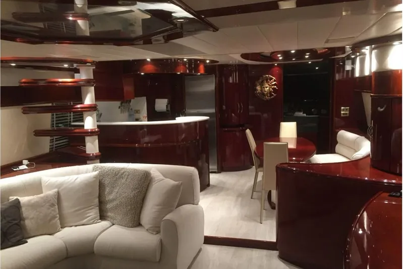  Yacht Photos Pics Luxurious interior of a 2003 Mochi 2250 yacht with elegant wood finishes and modern furnishings.