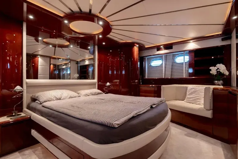  Yacht Photos Pics Luxurious Mochi 2250 yacht bedroom interior, featuring elegant wood finishes and modern design, 2003 model.