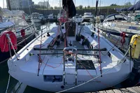 2022 Dehler 30 sailboat docked in marina, surrounded by other boats.