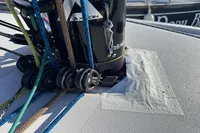 Dehler 30 sailboat deck with colorful ropes and pulleys, 2022 model.