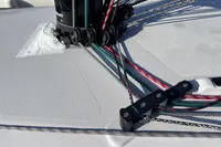 Deck rigging on 2022 Dehler 30 sailboat, featuring colorful ropes and pulleys.