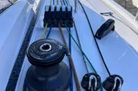 Dehler 30 sailboat deck with winch and colorful ropes, 2022 model.