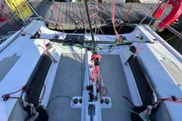 Cockpit of 2022 Dehler 30 sailboat with rigging and ropes, docked at marina.