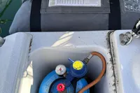 Dehler 30 yacht, 2022 model, showing gas cylinder and storage compartment.