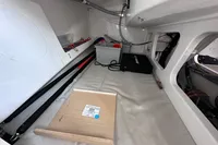 Interior of 2022 Dehler 30 sailboat, featuring storage compartments and equipment.