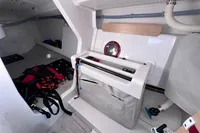 Interior of 2022 Dehler 30 sailboat, featuring storage and sailing gear.