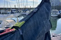 2022 Dehler 30 sailboat in marina, with sails and masts visible under clear blue sky.