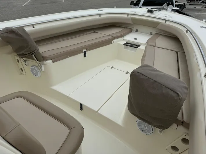  Yacht Photos Pics 2011 Scout 282 XSF boat interior with beige seating and storage compartments.