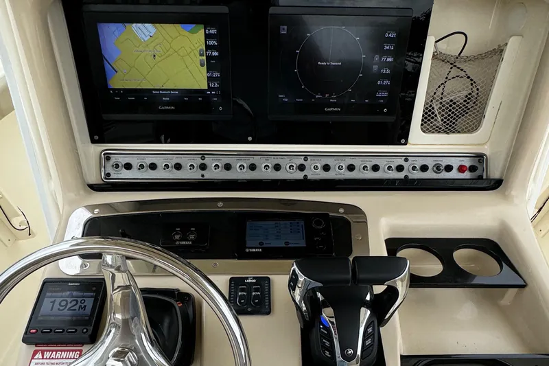  Yacht Photos Pics 2011 Scout 282 XSF boat dashboard with navigation screens and controls.