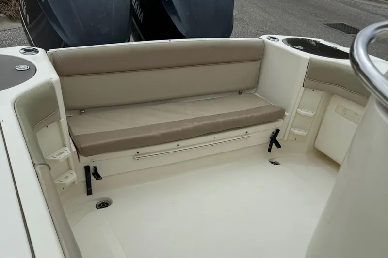  Yacht Photos Pics 2011 Scout 282 XSF boat interior with beige seating and storage compartments.