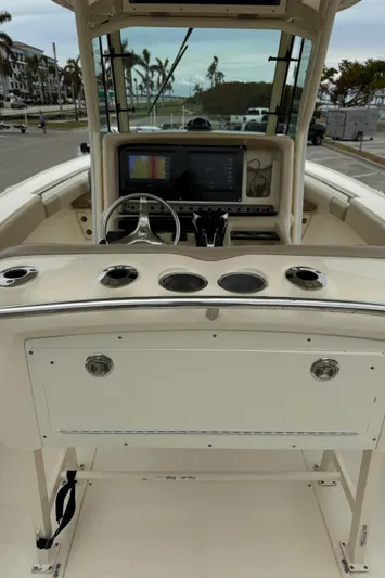  Yacht Photos Pics 2011 Scout 282 XSF boat dashboard with steering wheel and navigation system.
