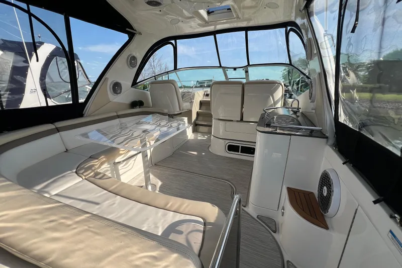  Yacht Photos Pics Luxurious interior of 2012 Sea Ray 370 Sundancer yacht with seating and dining area.