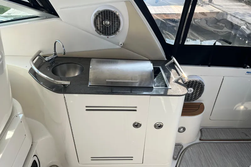  Yacht Photos Pics 2012 Sea Ray 370 Sundancer yacht kitchenette with sink and grill.