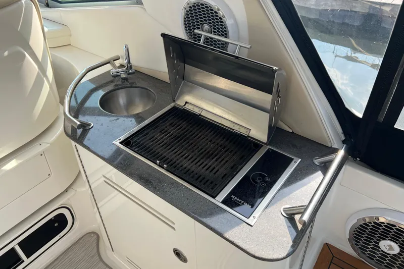  Yacht Photos Pics Outdoor kitchen on 2012 Sea Ray 370 Sundancer yacht with grill and sink.