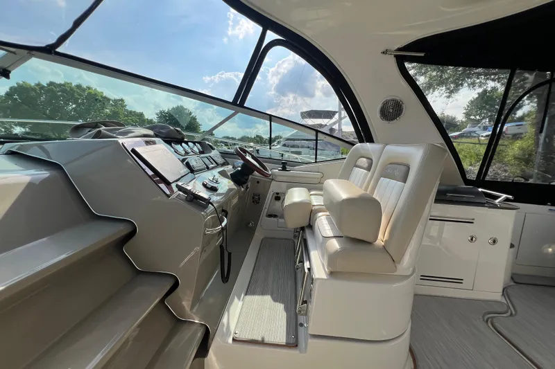  Yacht Photos Pics Interior cockpit of 2012 Sea Ray 370 Sundancer with modern controls and seating.