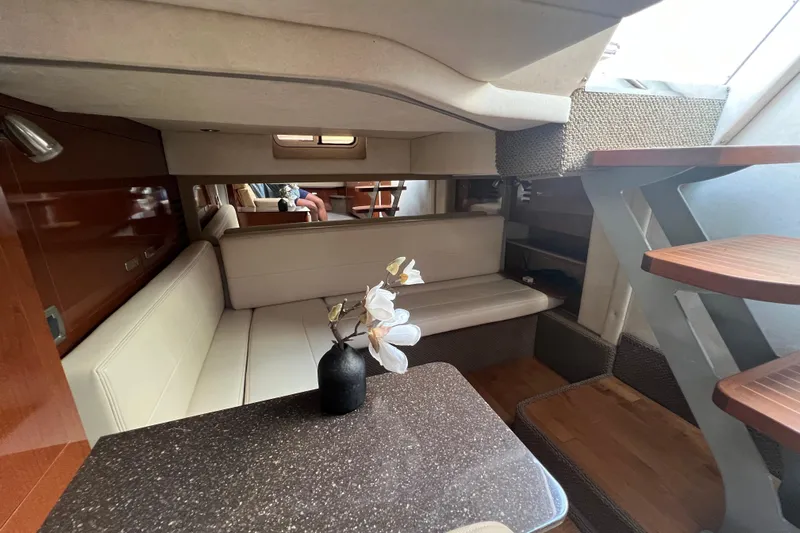  Yacht Photos Pics Luxurious interior of 2012 Sea Ray 370 Sundancer yacht with elegant seating and decor.