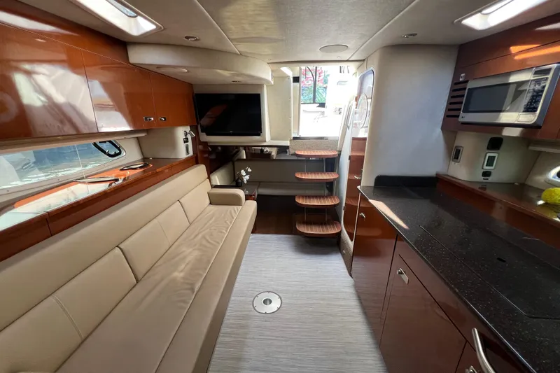  Yacht Photos Pics Luxurious interior of 2012 Sea Ray 370 Sundancer yacht with modern amenities and elegant design.