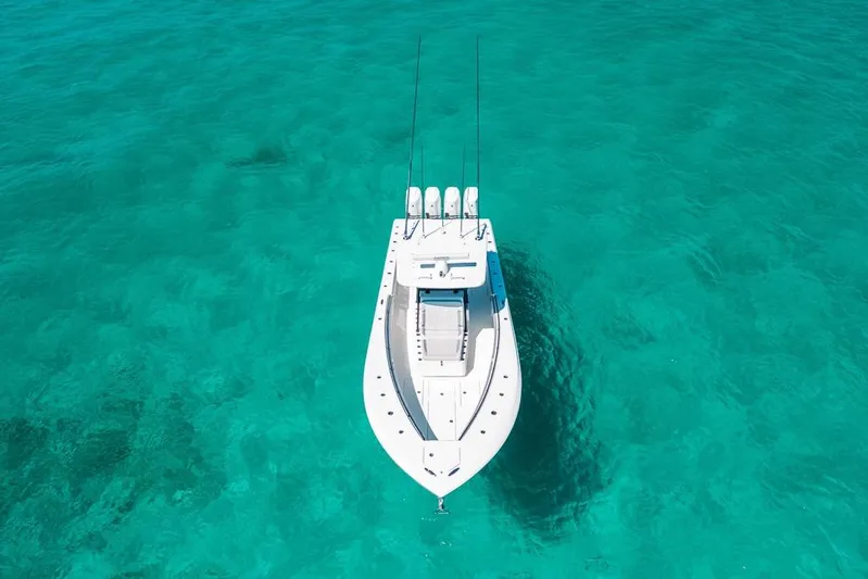  Yacht Photos Pics 2024 SeaHunter 39 Tournament boat on clear turquoise water, aerial view.