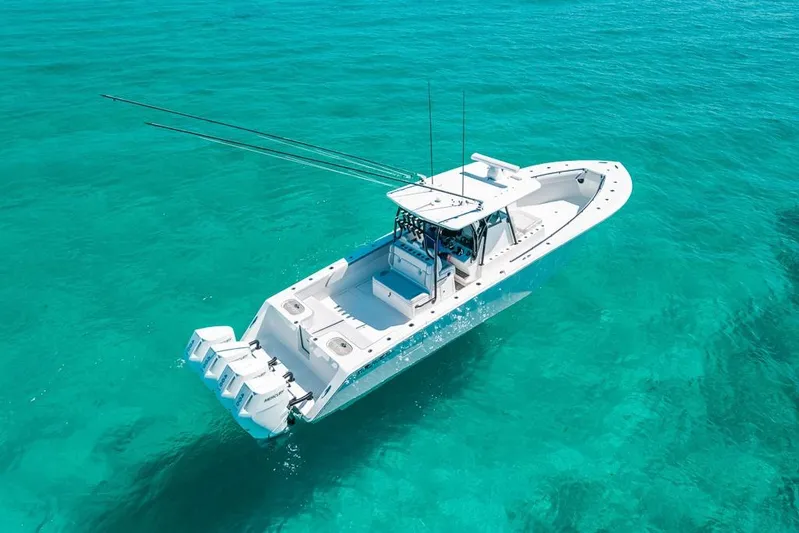  Yacht Photos Pics 2024 SeaHunter 39 Tournament boat on clear turquoise water, aerial view.