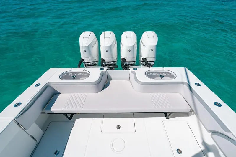  Yacht Photos Pics 2024 SeaHunter 39 Tournament boat with four outboard engines on turquoise water.