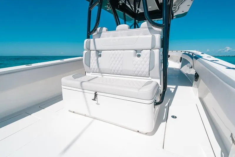  Yacht Photos Pics 2024 SeaHunter 39 Tournament boat interior with white seating and ocean backdrop.