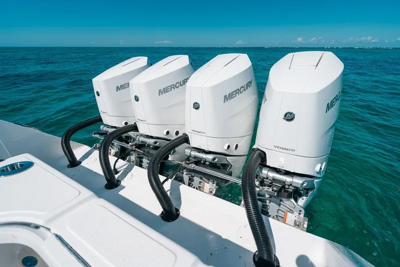  Yacht Photos Pics Four Mercury Verado outboard engines on 2024 SeaHunter 39 Tournament boat in clear blue water.