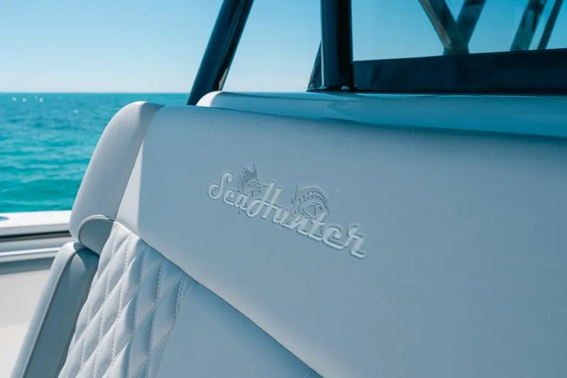  Yacht Photos Pics 2024 SeaHunter 39 Tournament boat interior with logo, ocean view in background.