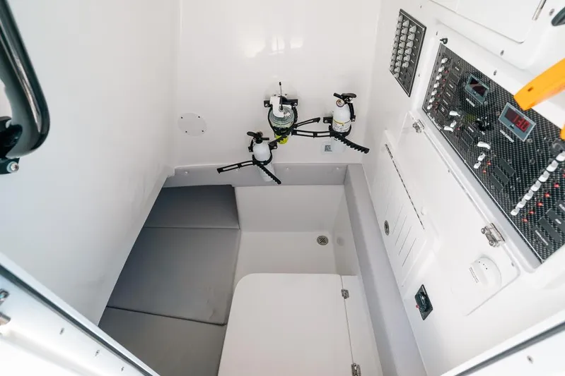  Yacht Photos Pics 2024 SeaHunter 39 Tournament interior with control panels and storage area.