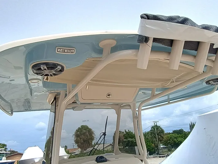  Yacht Photos Pics 2025 Grady-White Canyon 271 boat with T-top and rod holders, under a clear sky.