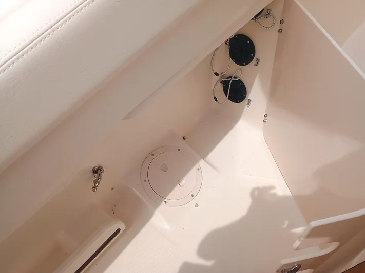  Yacht Photos Pics Interior view of 2025 Grady-White Canyon 271 boat, featuring storage compartment and fixtures.