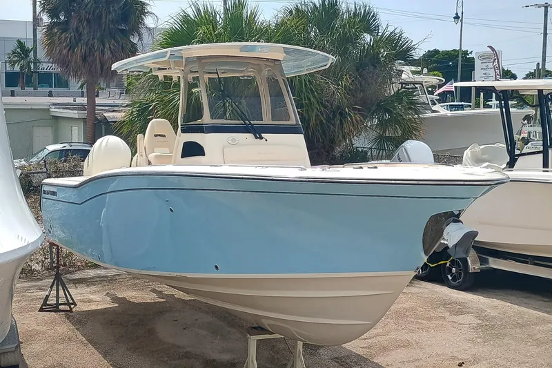  Yacht Photos Pics 2025 Grady-White Canyon 271 boat in light blue, displayed outdoors.