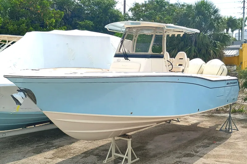  Yacht Photos Pics 2025 Grady-White Canyon 271 boat in light blue, docked outdoors.