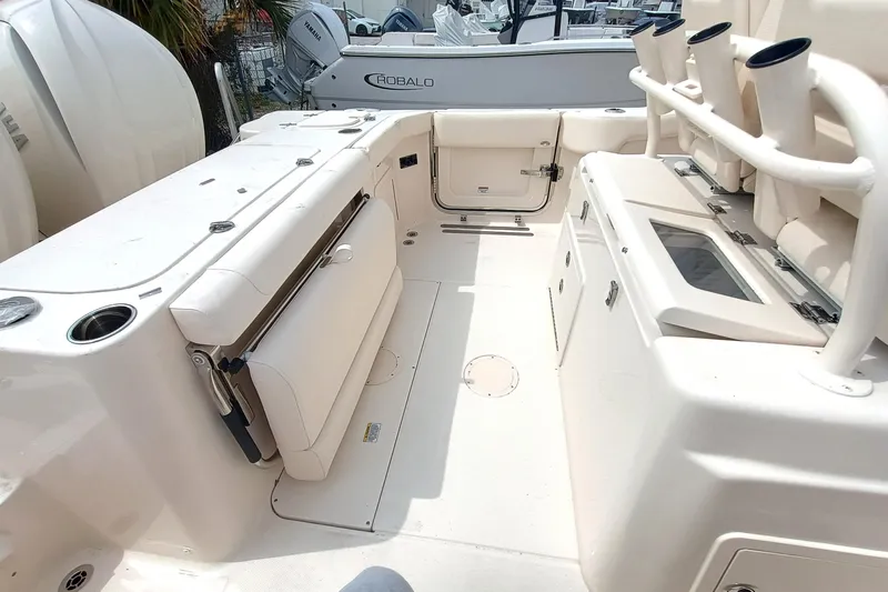  Yacht Photos Pics 2025 Grady-White Canyon 271 boat interior with seating and storage compartments.