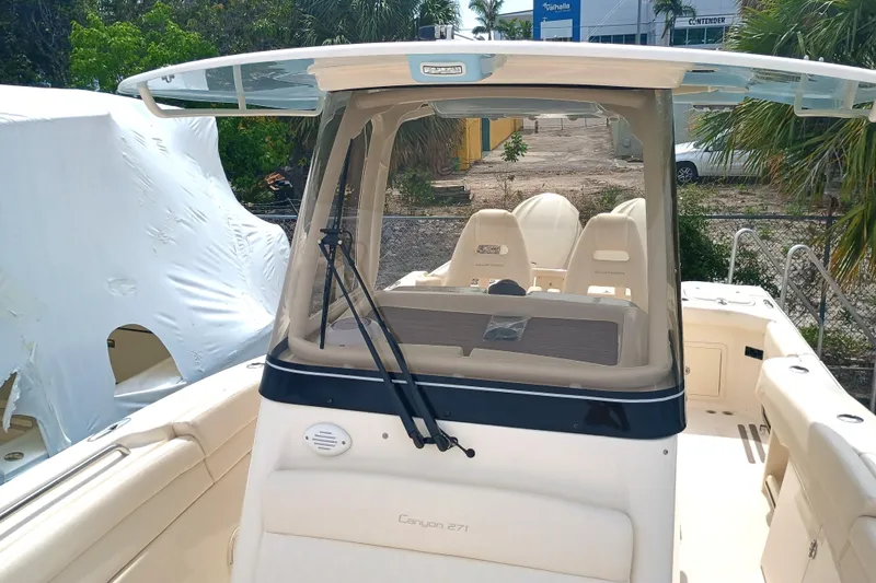  Yacht Photos Pics 2025 Grady-White Canyon 271 boat, featuring a sleek design and spacious seating area.