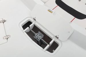 Open storage compartment on a 2021 Tahoe 1950 boat, featuring a white interior.