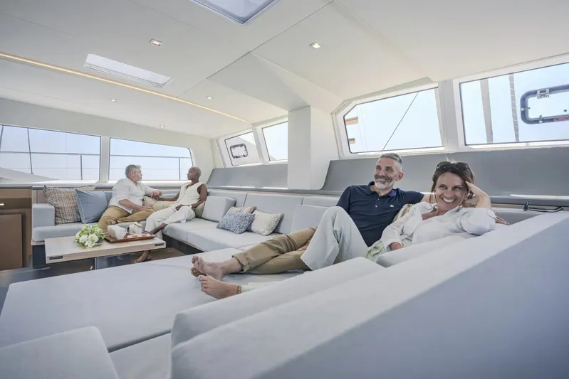  Yacht Photos Pics Couples relaxing in the luxurious interior of a 2027 Privilege Signature 650 yacht.